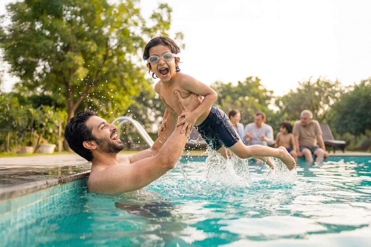 A family enjoying time together in a swimming pool